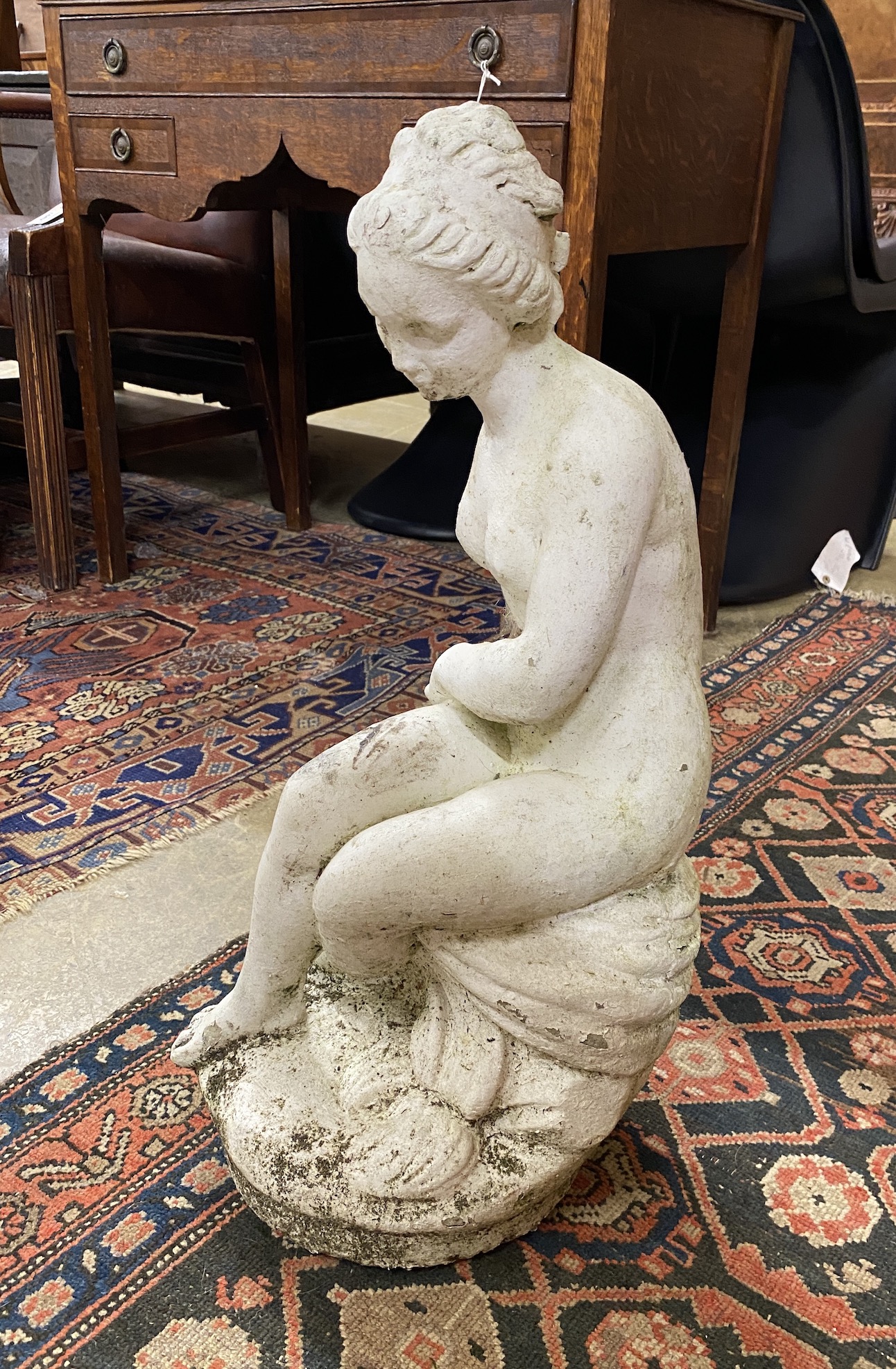 A painted reconstituted stone garden ornament of a female bather, height 63cm